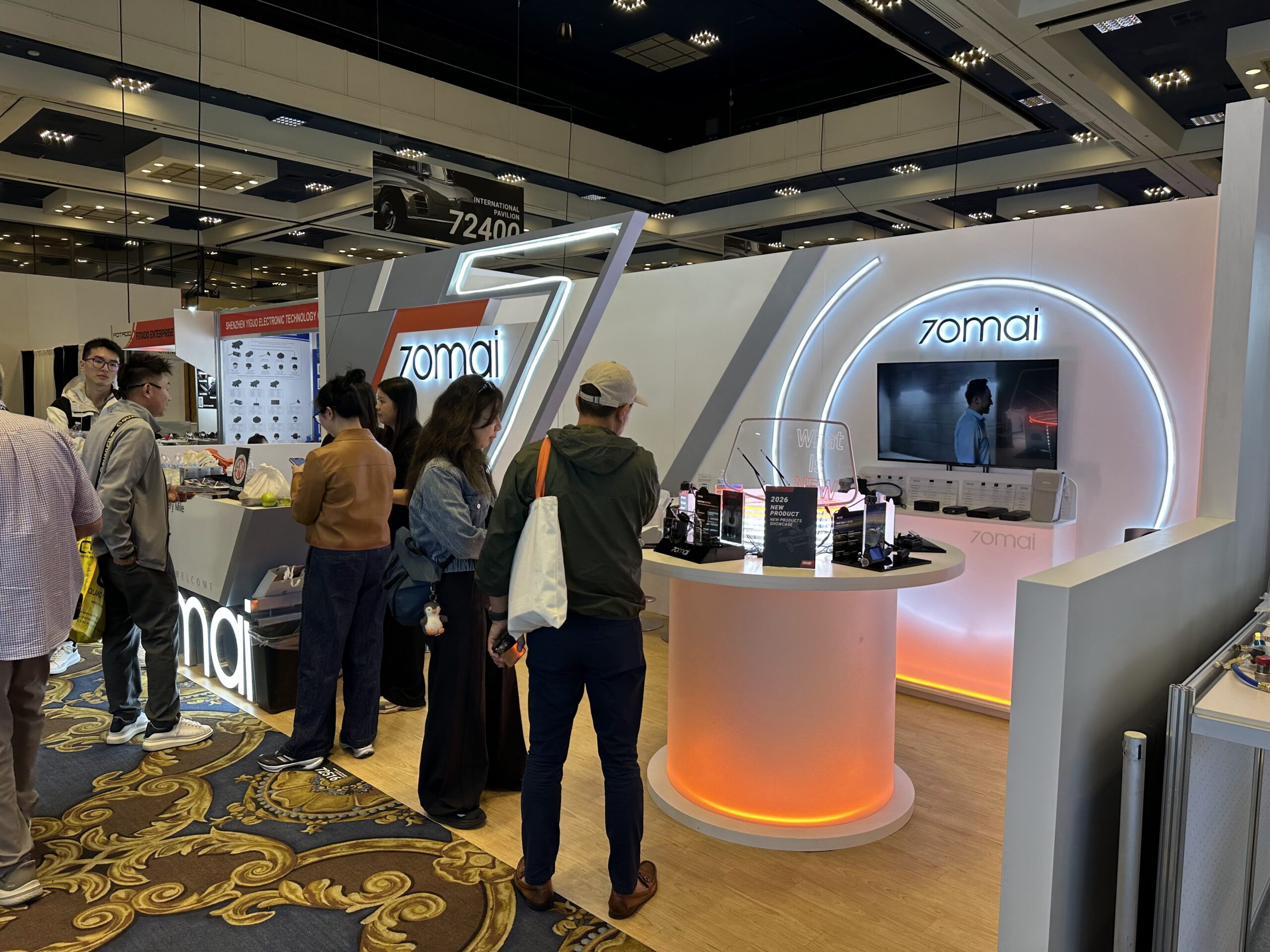 Visitors exploring the 70mai SEMA booth in Las Vegas