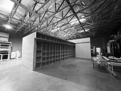 Large grid display wall assembled during exhibit pre-build