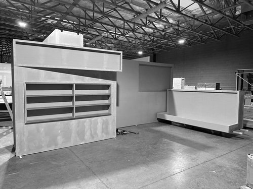 Product shelving wall and reception counter in the workshop