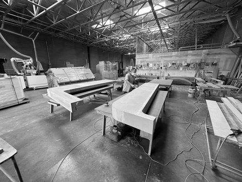 Custom counters and millwork parts staged for assembly