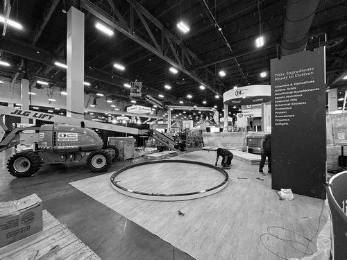 Boom lift positioning the H&M USA circular hanging sign