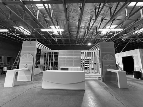 Completed exhibit pre-build with curved counter and display frames