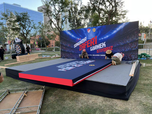 Large-format graphic stage backdrop installed for an outdoor event