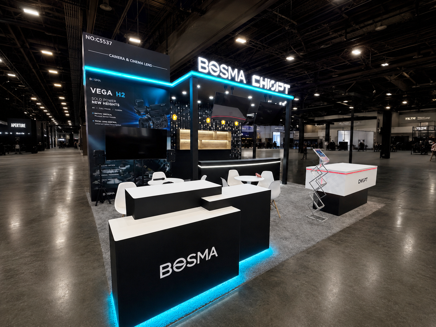 BESMA technology booth with illuminated branded counters