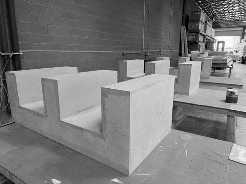 Finished white counters and display structures in the workshop