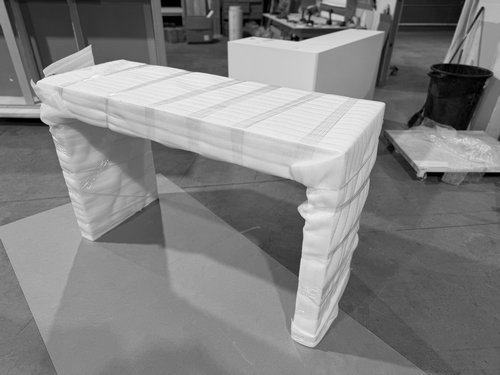 Wrapped exhibit counter prepared for transport