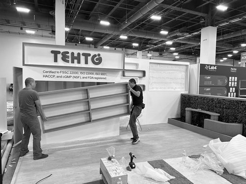 Install crew carrying a curved product display into position