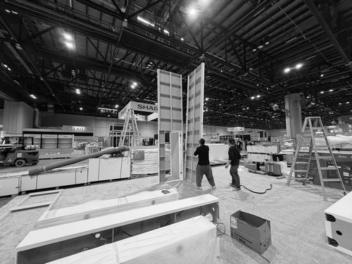 Wide trade show floor during booth construction and installation