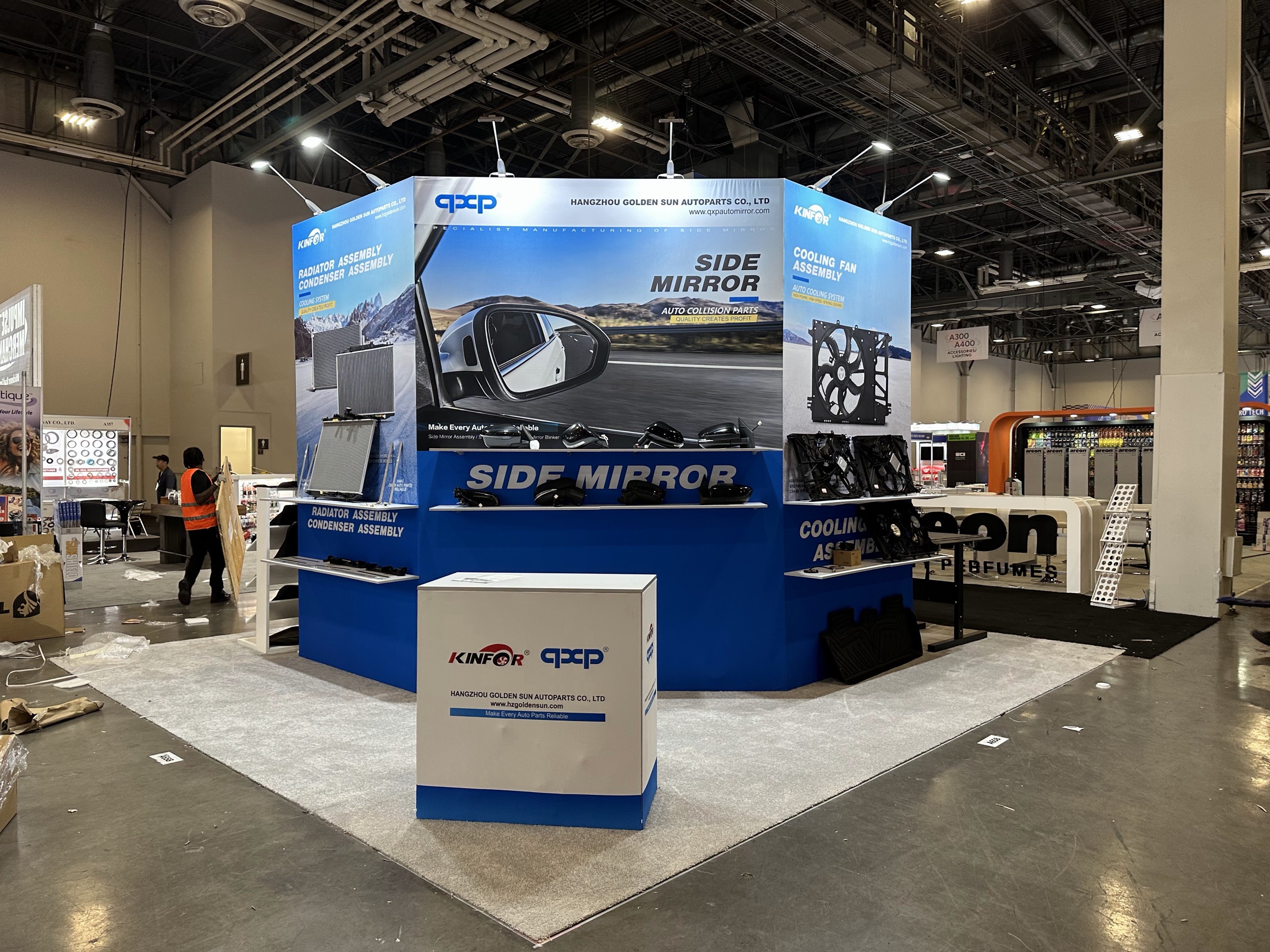 Kinfor auto-parts display wall with mirrors, radiators and cooling fans at SEMA