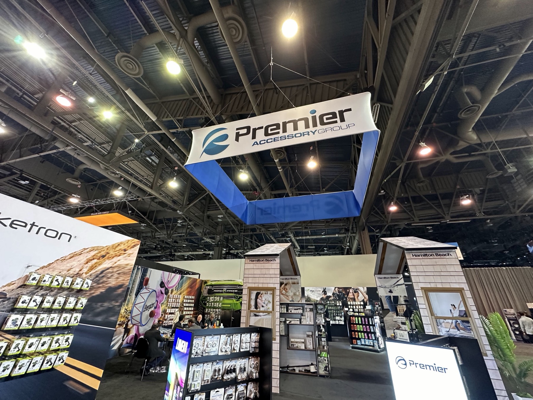 Suspended Premier Accessory Group sign above the CES 2025 exhibit